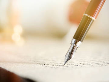 pen writing on paper